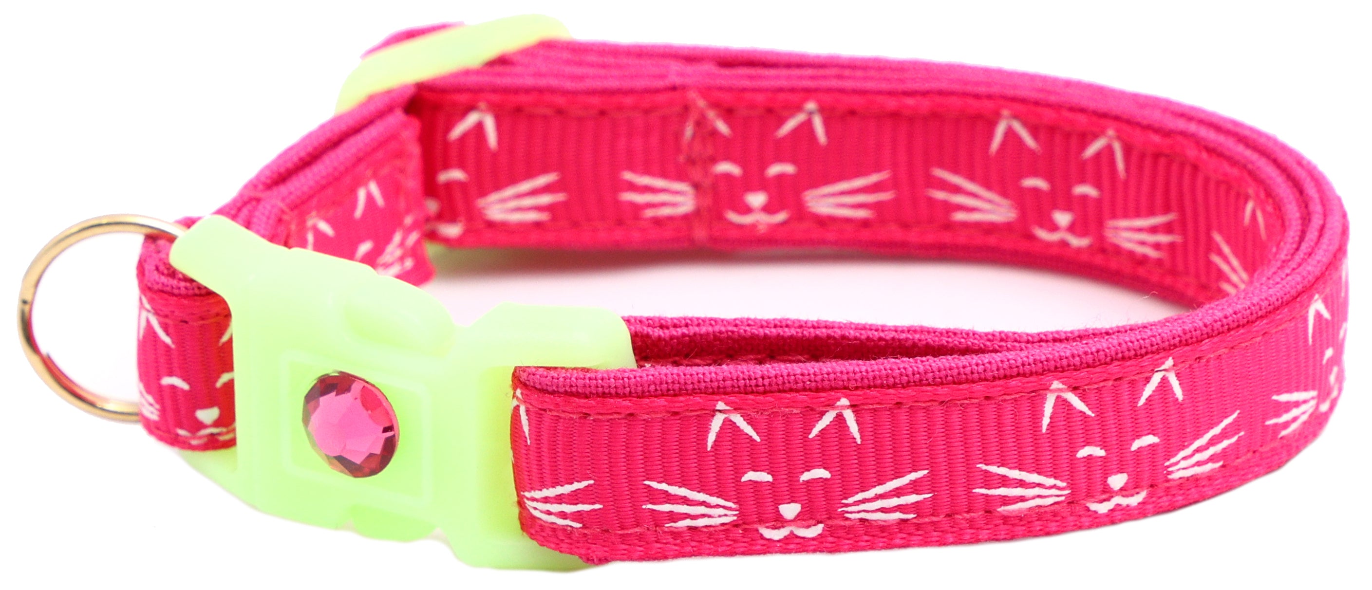 A glowing cat faces breakaway collar made of reinforced cotton, featuring a bell and charm, perfect for nighttime visibility.
